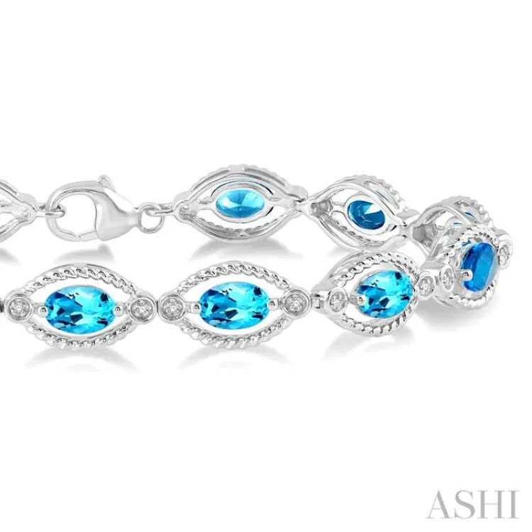 1/10 Ctw Round Cut Diamond & 6x4MM Oval Cut Blue Topaz Semi Precious Bracelet in Sterling Silver