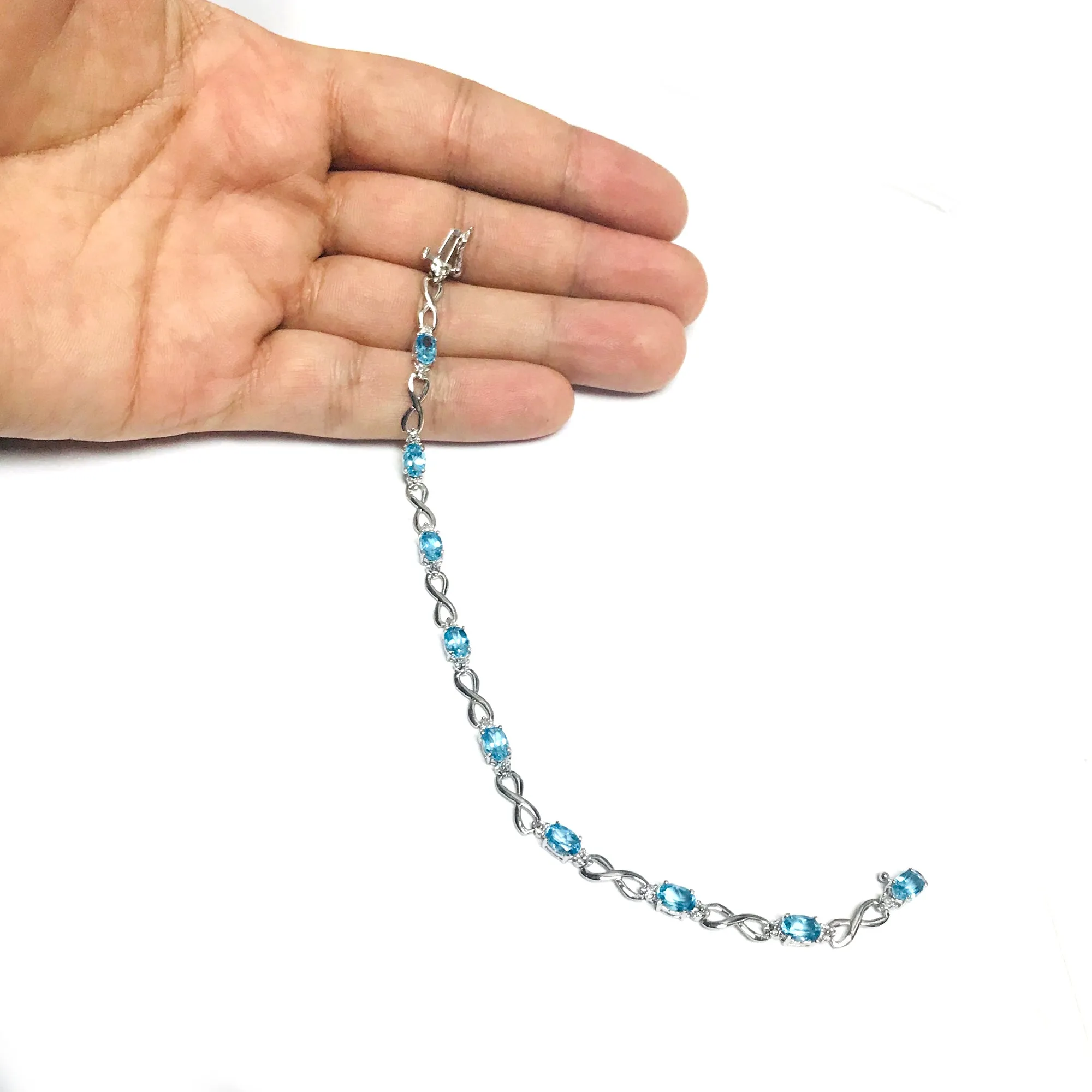 14K White Gold Oval Blue Topaz Stones And Diamonds Infinity Tennis Bracelet, 7"