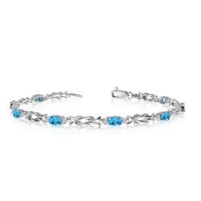 14K White Gold Oval Blue Topaz Stones And Diamonds Tennis Bracelet, 7"