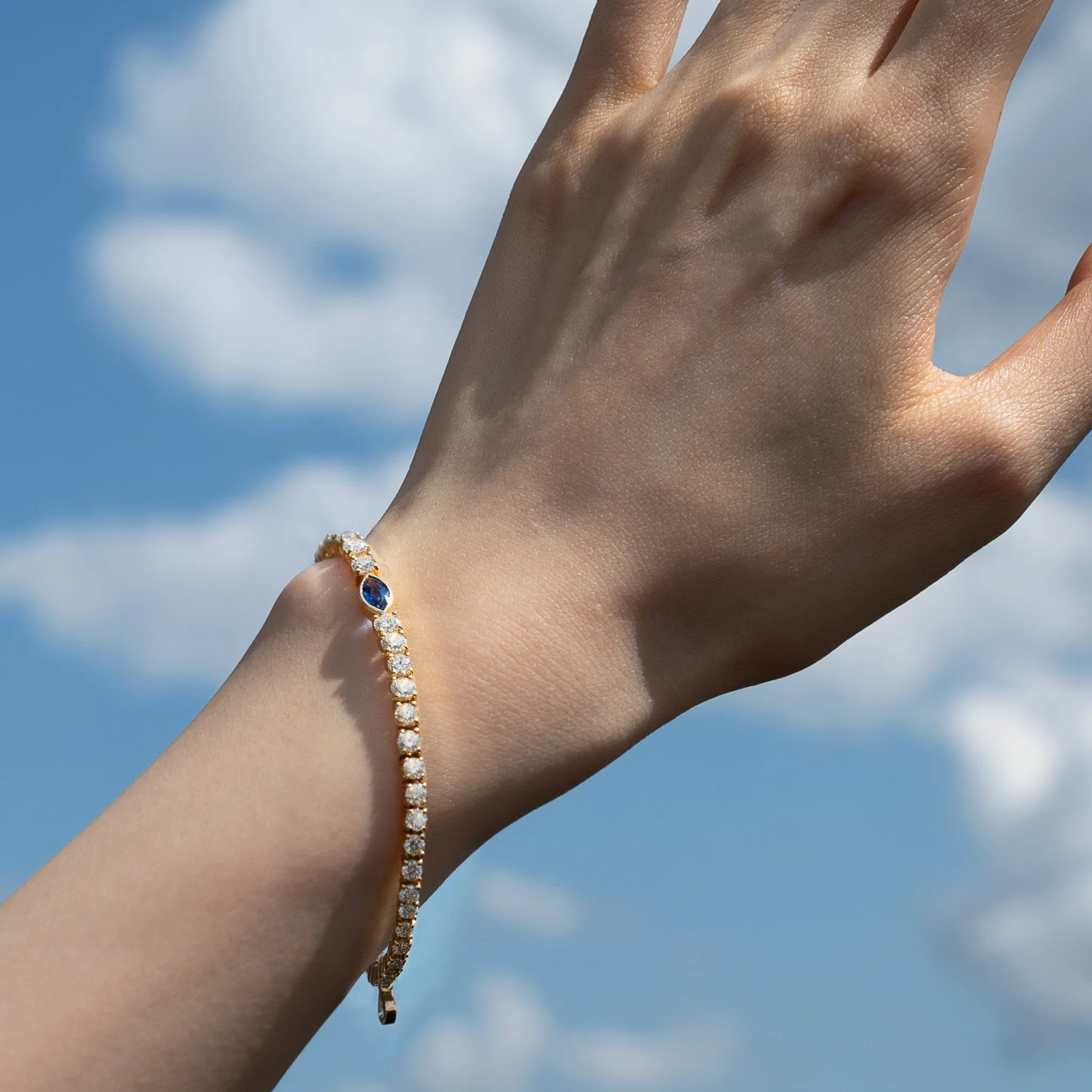 Center Marquise Blue Sapphire and Round Diamond Tennis Bracelet