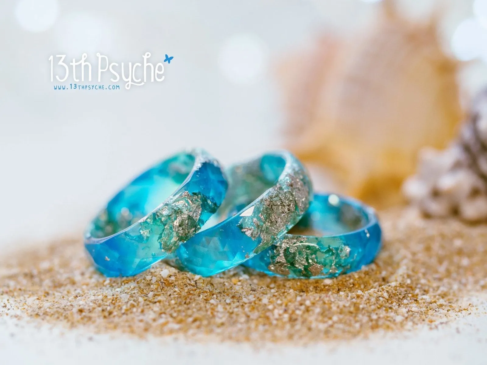 Clear blue and turquoise faceted resin ring with silver flakes