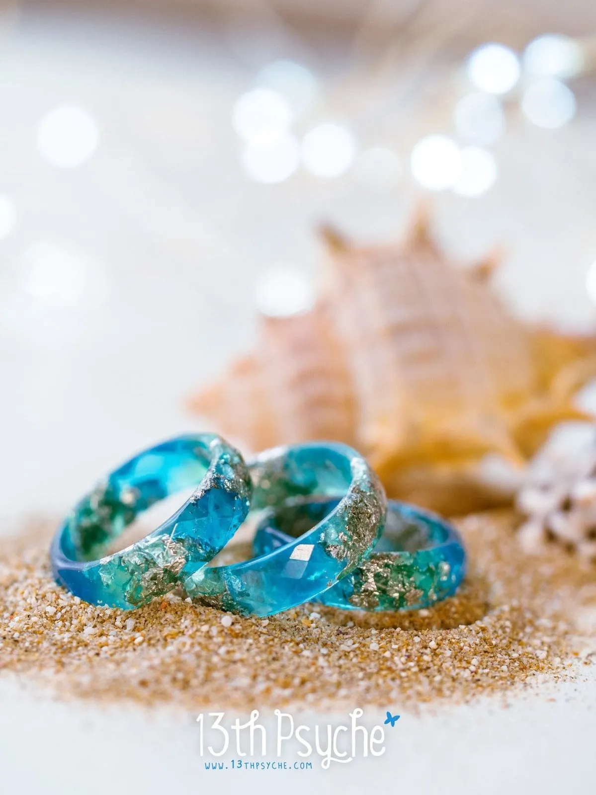 Clear blue and turquoise faceted resin ring with silver flakes